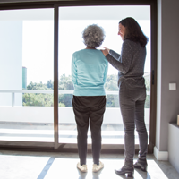 daughter showing to mother her new apartment