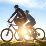 stock image of parent and child riding bicycles