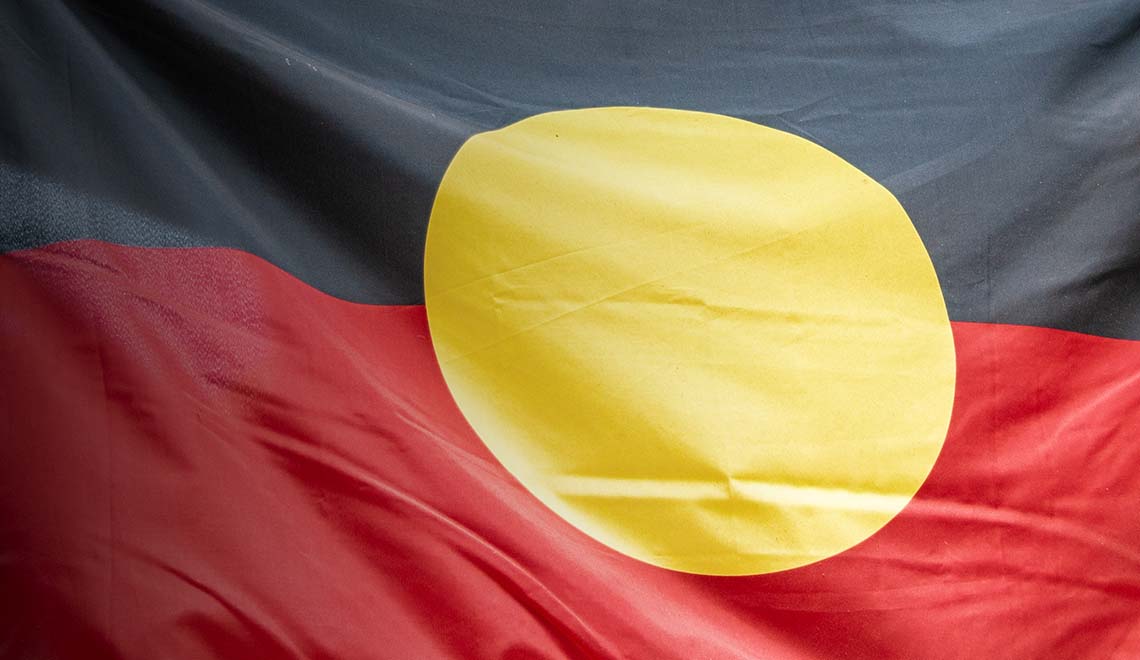 Closeup of Aboriginal flag in Port Douglas, Australia. stock photo