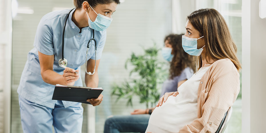 Pregnant woman consulting a nurse