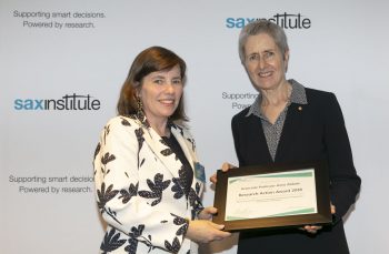 NHMRC CEO Prof Anne Kelso presents Research Action Awards 2018 winner A/Prof Anne Abbott with her certificate