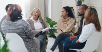 Men and women healing during psychologist meeting talking about mental health