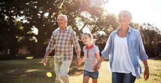 Multi-generational family walking in the park